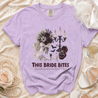Purple t-shirt with spooky wedding graphic and text "THIS BRIDE BITES".
