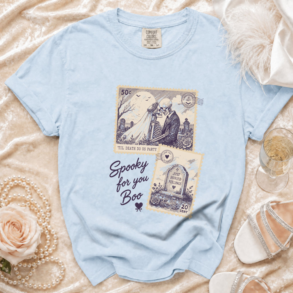 Light blue t-shirt with skeleton wedding and tombstone prints saying "Spooky for you Boo".