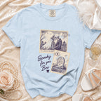 Light blue t-shirt with skeleton wedding and tombstone prints saying "Spooky for you Boo".