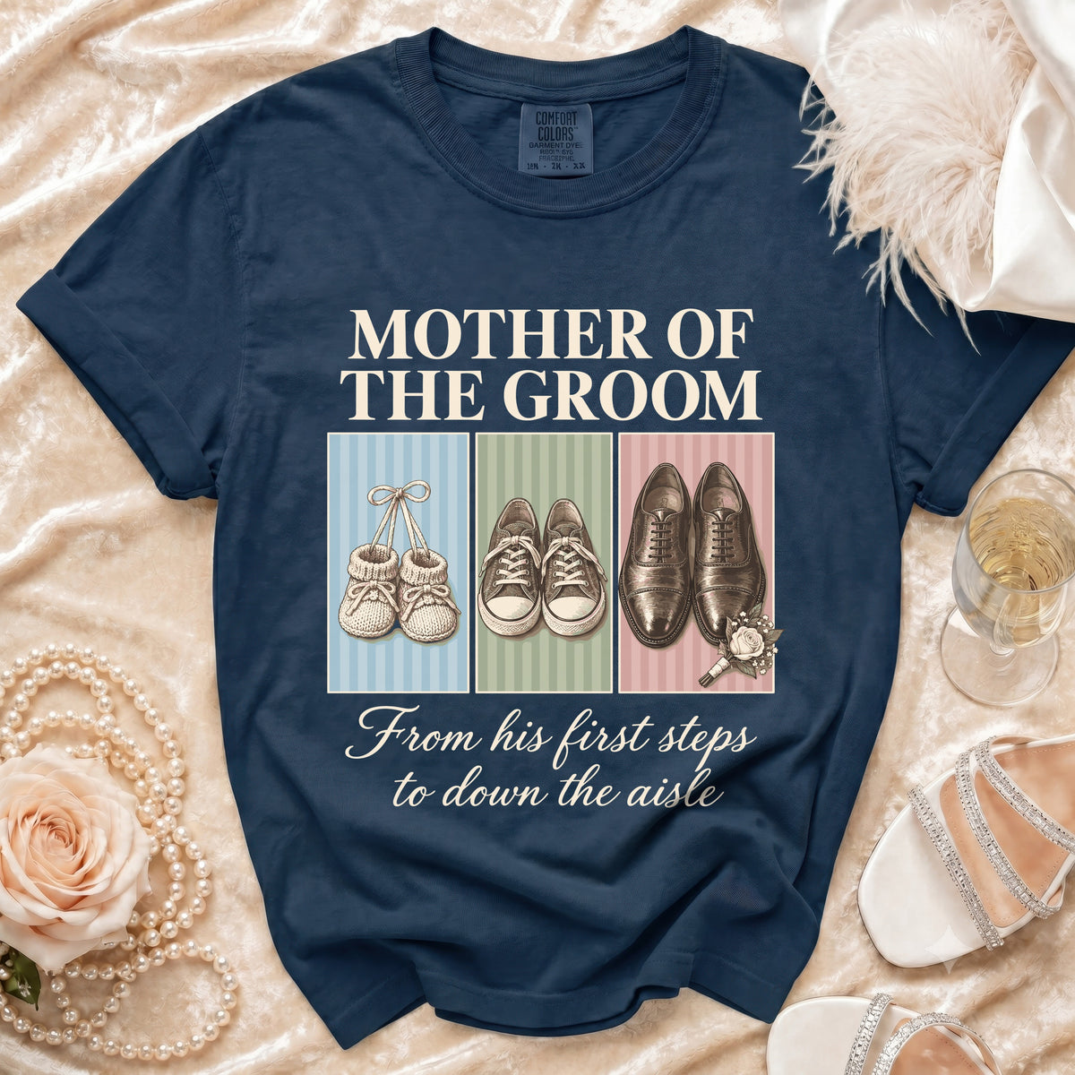 Navy t-shirt with "Mother of the Groom" and "From his first steps to down the aisle."