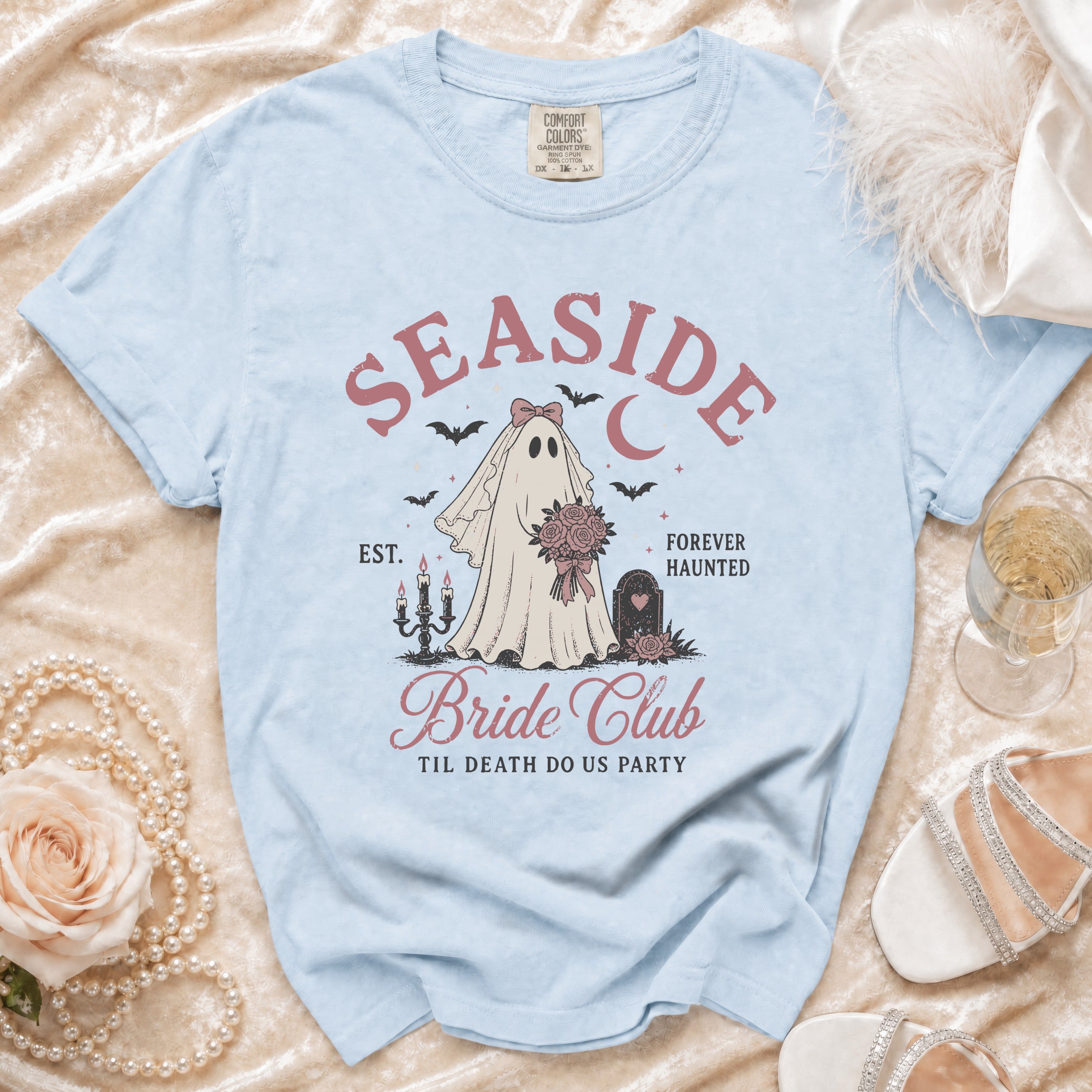 Light blue t-shirt with ghost bride graphic: "Seaside Bride Club", "Til Death Do Us Party".