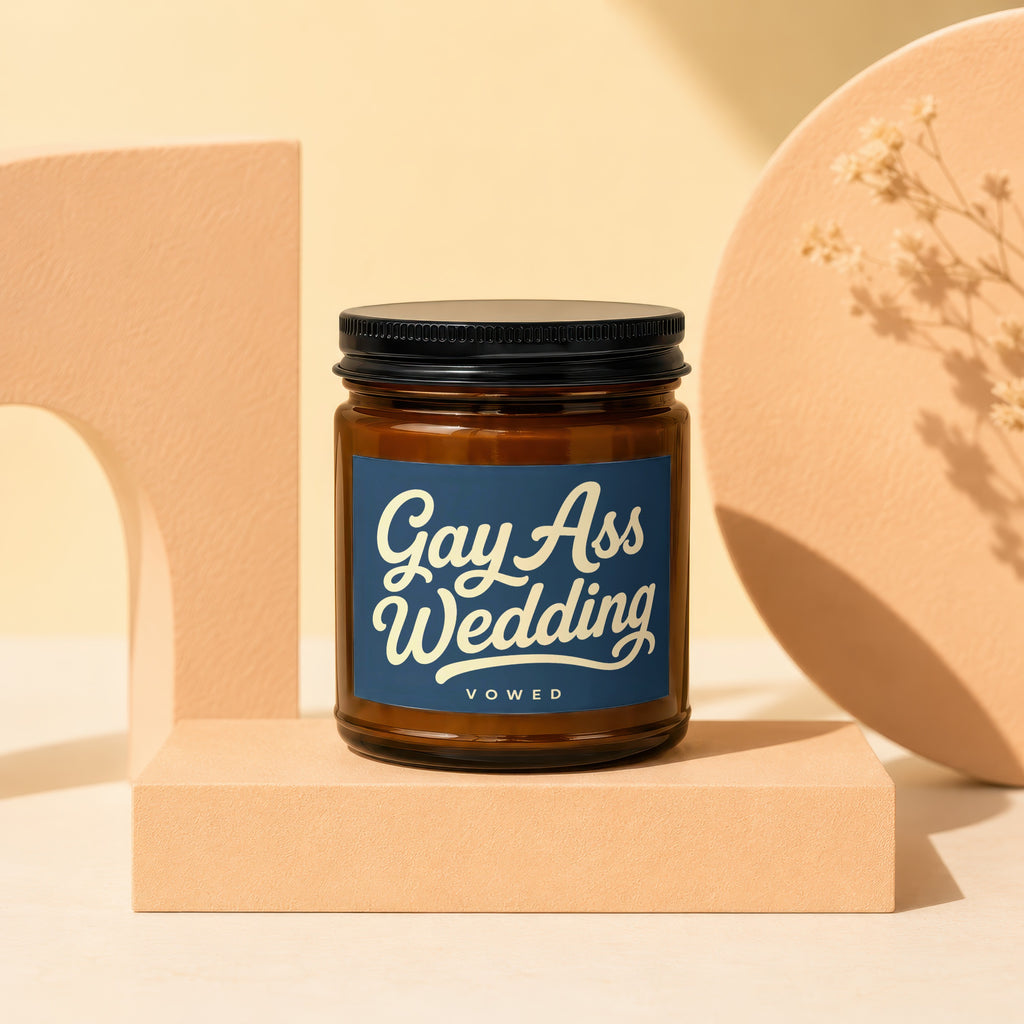Brown glass candle with "Gay Ass Wedding VOWED" text on label.