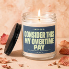 Jar candle with blue label: "INVOICE: CONSIDER THIS MY OVERTIME PAY"