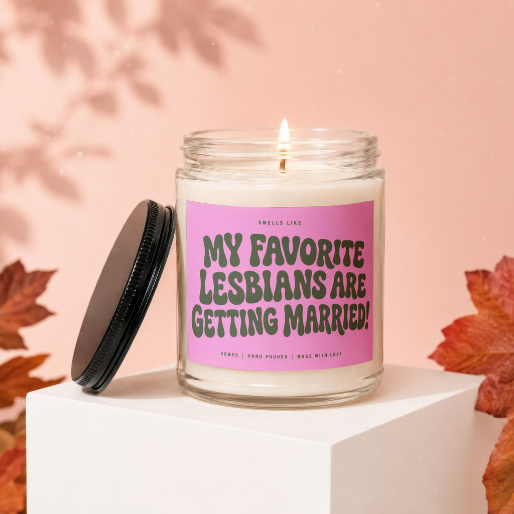 Glass jar candle with "MY FAVORITE LESBIANS ARE GETTING MARRIED!" text.