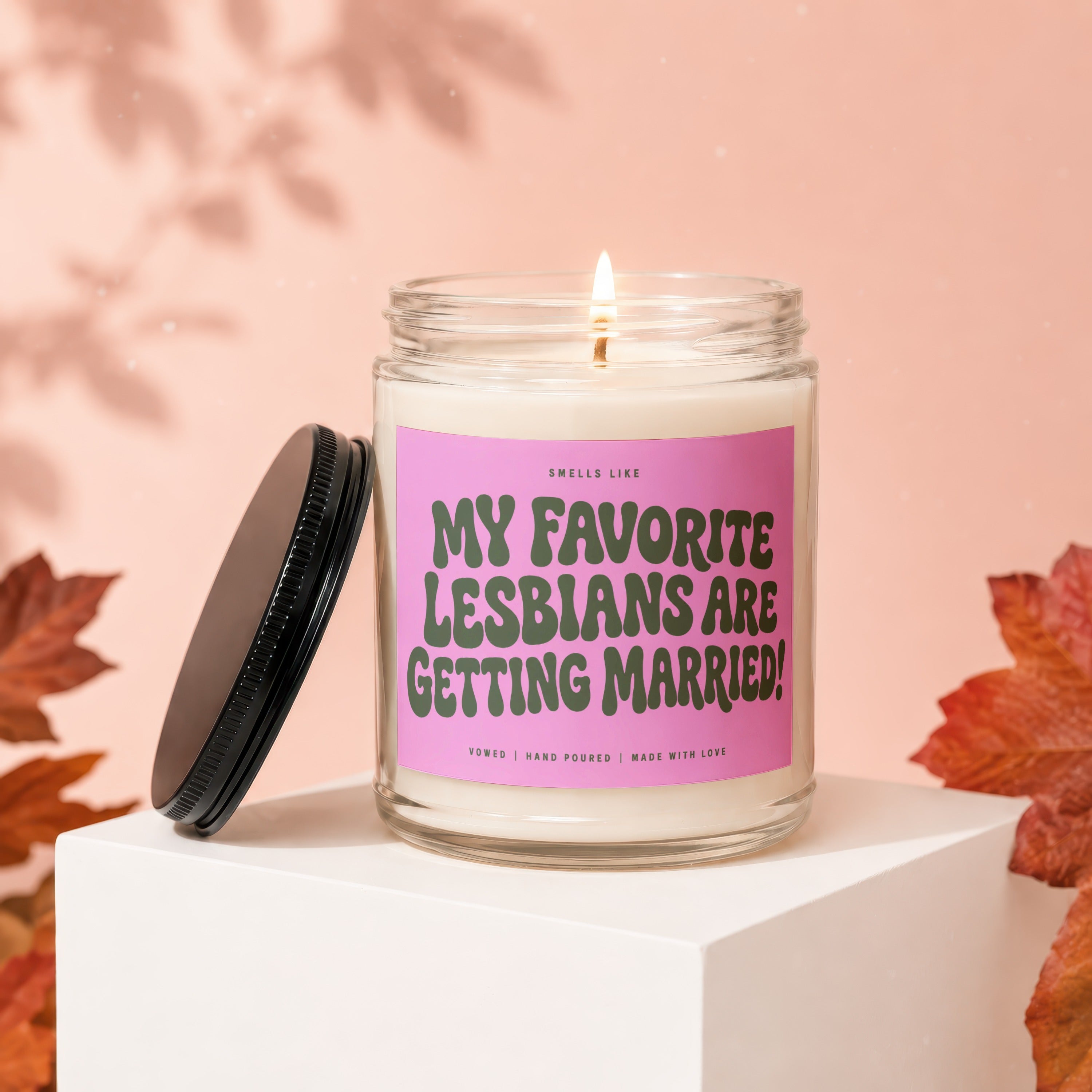 Glass jar candle with "MY FAVORITE LESBIANS ARE GETTING MARRIED!" text.