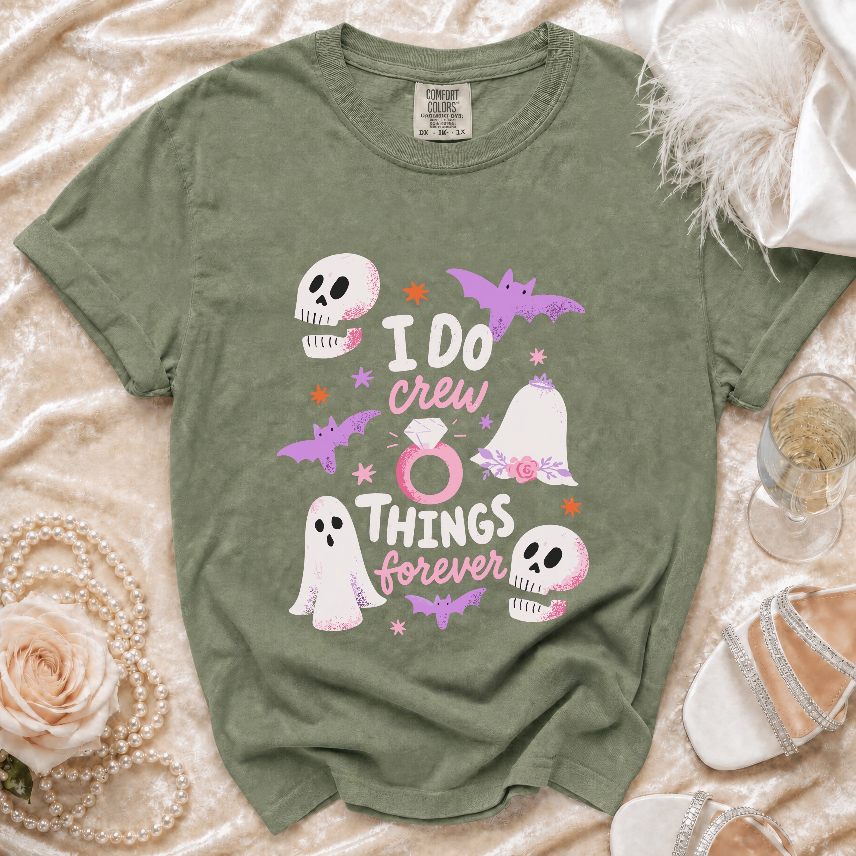 Green t-shirt with "I DO crew THINGS forever" text and Halloween-themed graphics.