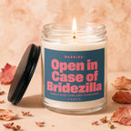 Candle with burnt wick and dark blue label reading "Open in Case of Bridezilla".