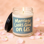 Candle with lit wick and text "Marriage Looks Good on Us".