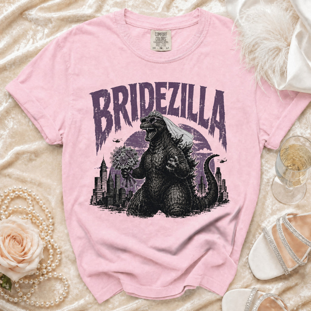 Pink t-shirt with "Bridezilla" text and Godzilla wearing a veil and heart sunglasses.
