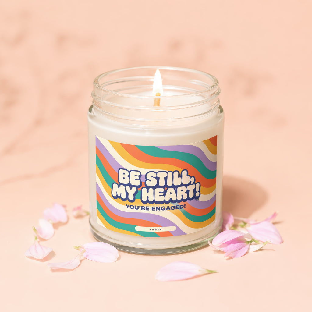 Lit candle with "Be Still, My Heart! You're Engaged!" text and floral accents.