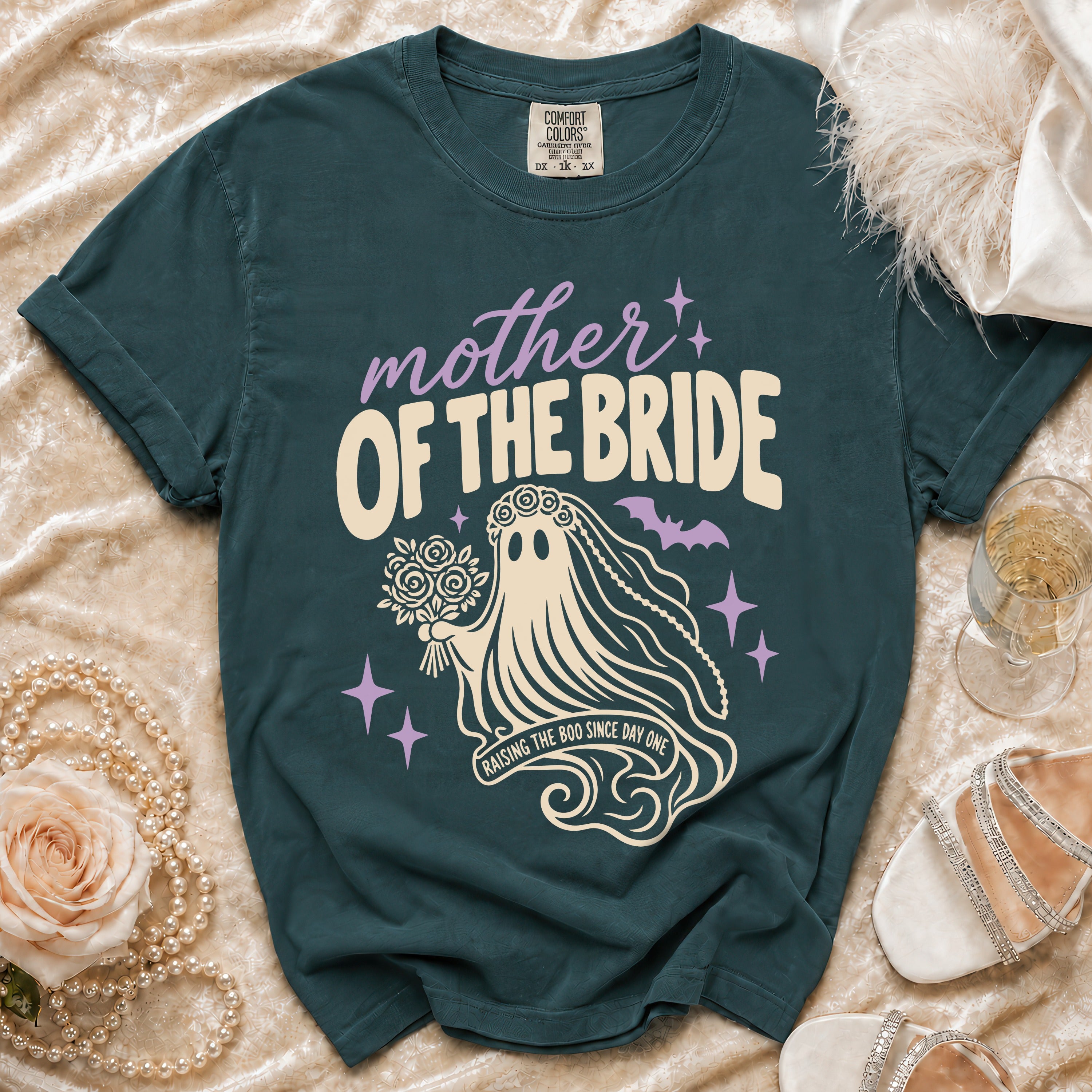 Teal t-shirt with "Mother of the Bride Raising the Boo Since Day One" ghost graphic.