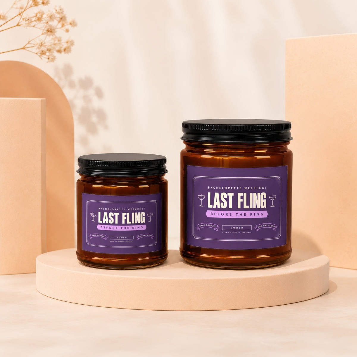 Two glass candles with "Last Fling Before the Ring" labels on purple backgrounds.