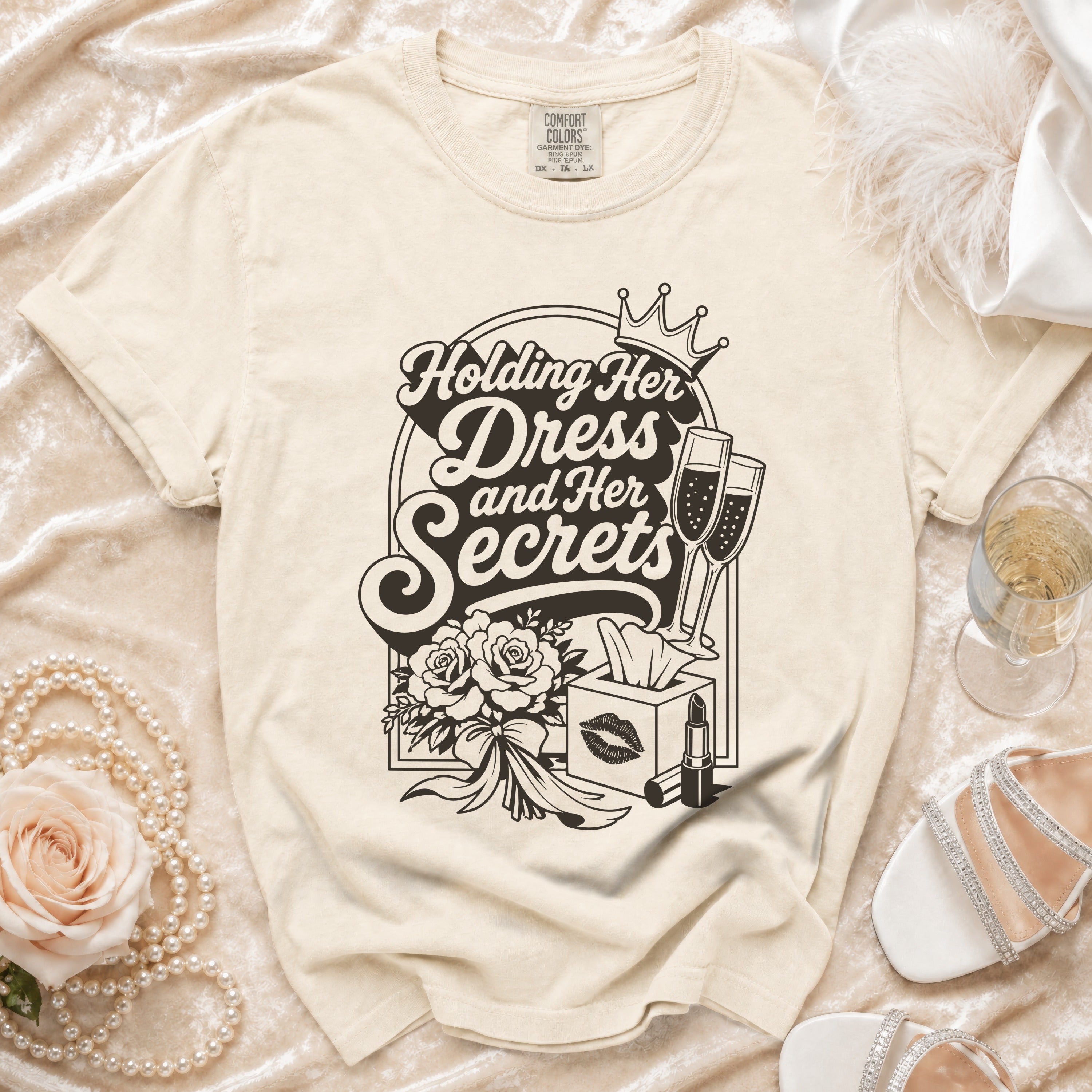 Cream t-shirt with "Holding Her Dress and Her Secrets" graphic.