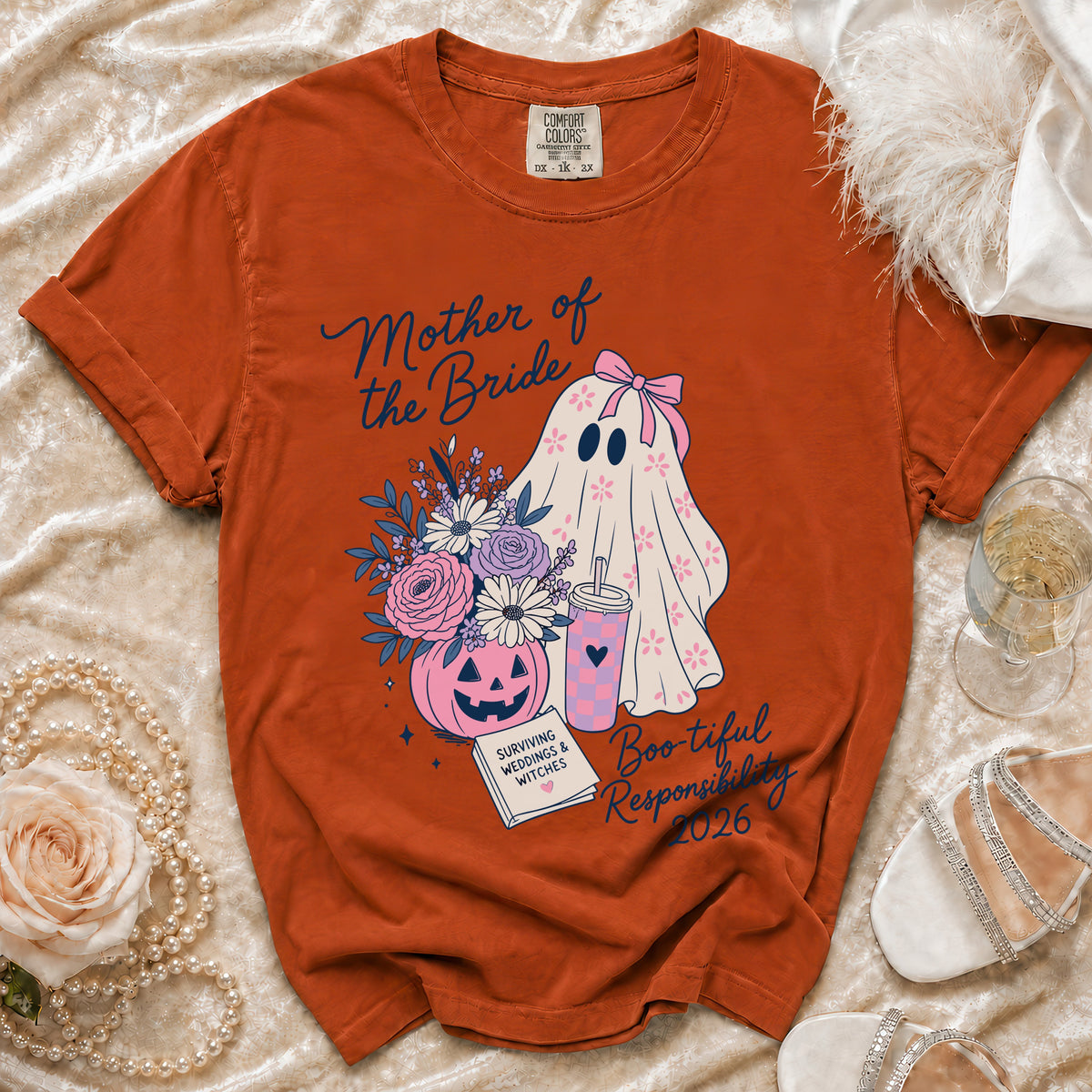 Orange shirt with "Mother of the Bride" and ghost graphic, year 2026.