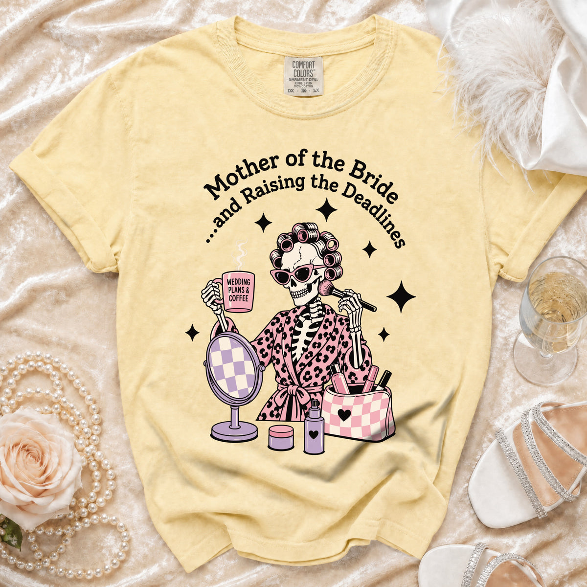 Yellow t-shirt with skeleton graphic and text: "Mother of the Bride...and Raising the Deadlines".
