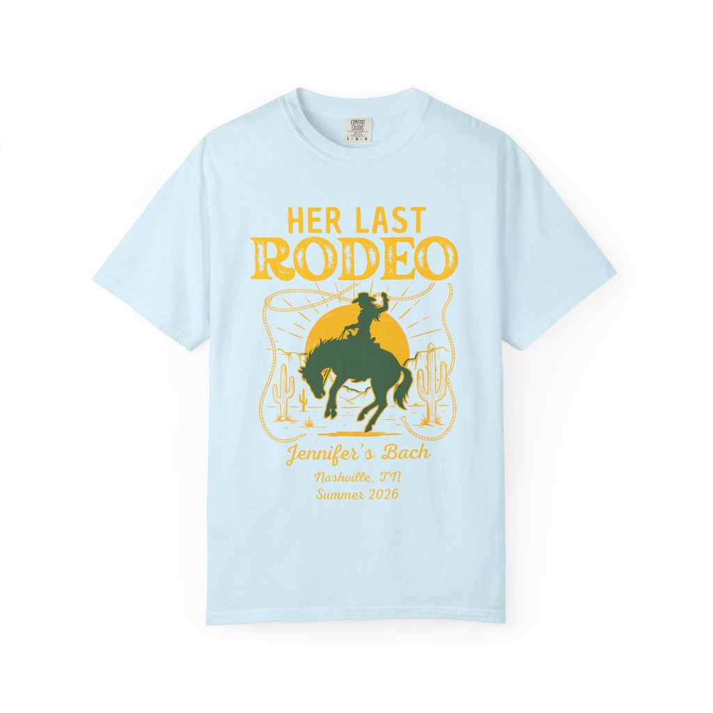 Light blue t-shirt with "Her Last Rodeo" text and cowboy on a horse graphic.