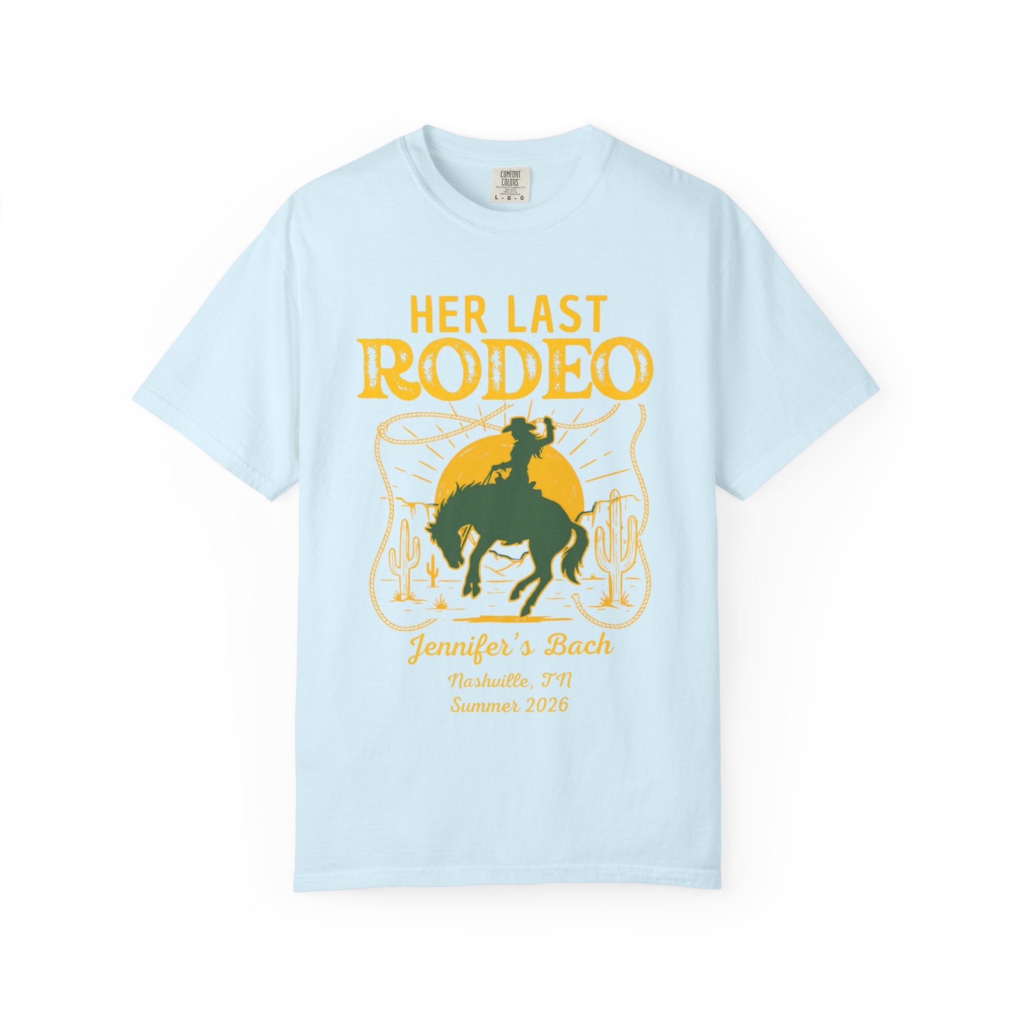 Light blue t-shirt with "Her Last Rodeo" text and cowboy on a horse graphic.