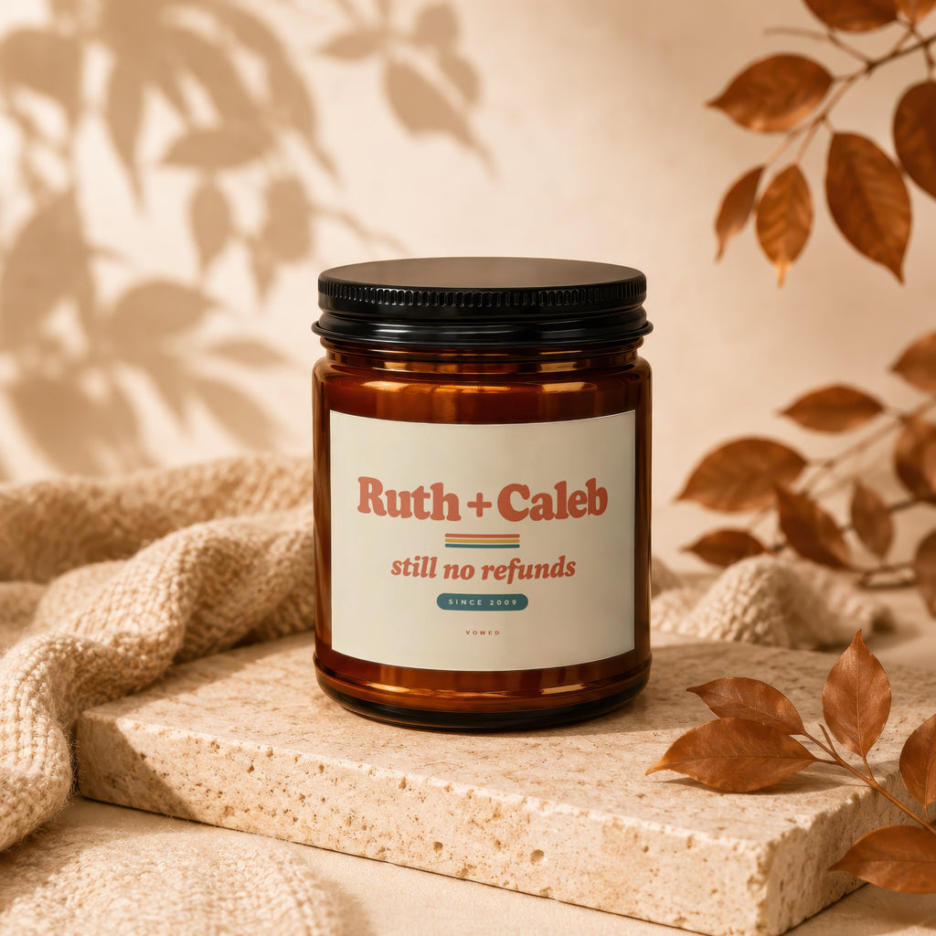 Amber jar candle with black lid, "Ruth + Caleb still no refunds SINCE 2009" label.