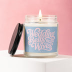 Pillar candle in glass jar with lid off, featuring "Wedding Bells for the Wives" text.