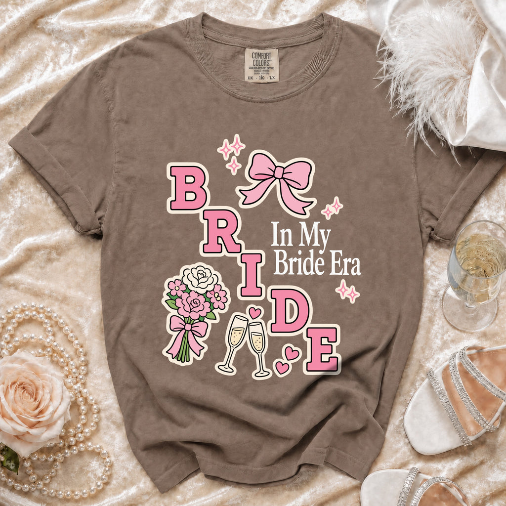 Brown t-shirt with "Bride In My Bride Era" graphic and wedding elements.