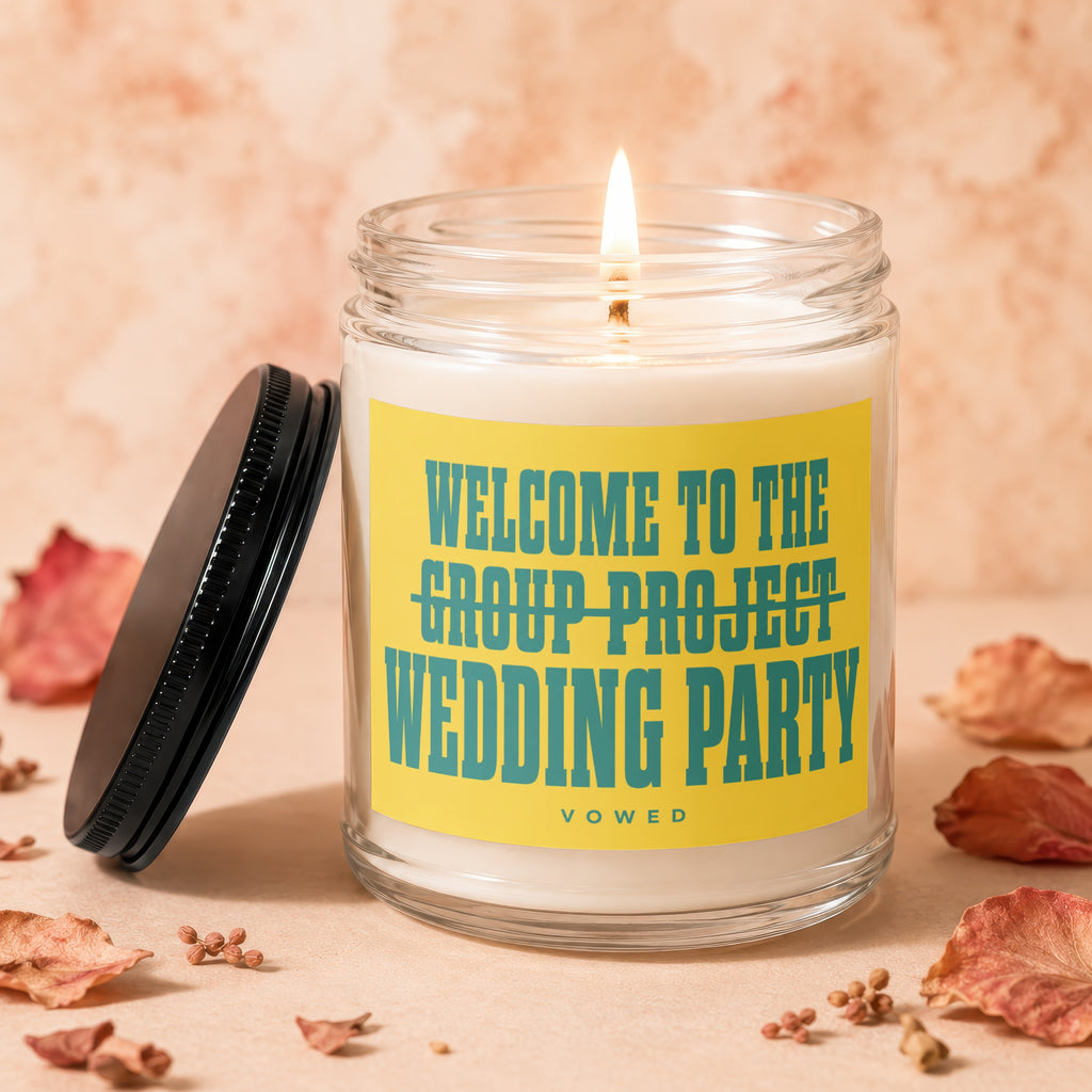 Candle with text "Welcome to the wedding party" on yellow label.