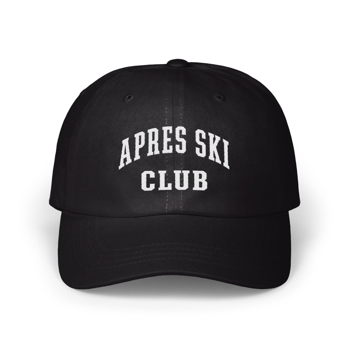 A black baseball cap with white embroidered text reading APRES SKI CLUB on the front.