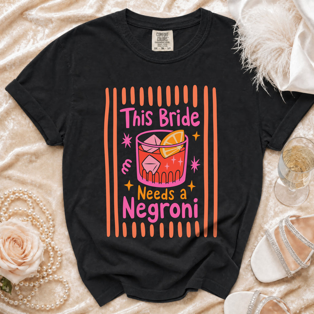 Black t-shirt with "This Bride Needs a Negroni" text and cocktail graphic.