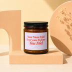 Amber jar candle with black lid, label reads "Your Mom Told Everyone Before You Did."
