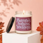 Jar candle with lid off, featuring the text "Betrothed, bothered, bewildered" and "vowed".