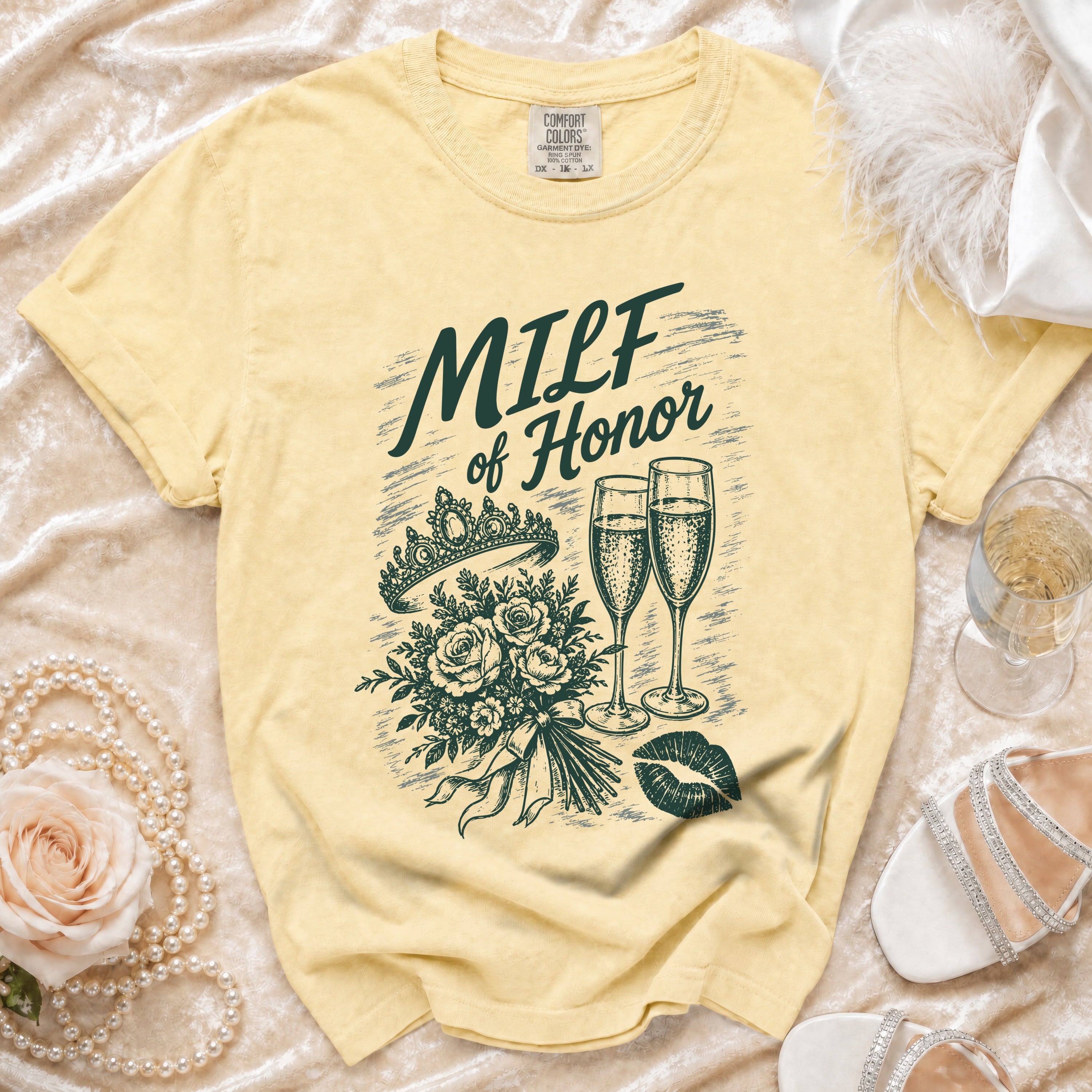 Yellow t-shirt with "MILF of Honor" text, crown, flowers, champagne, and lips design.