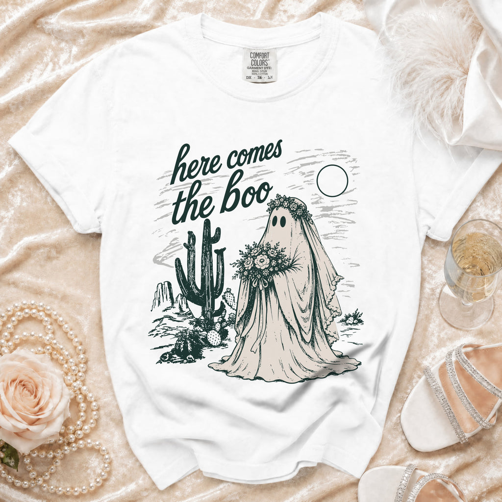 White t-shirt with "here comes the boo" text and a ghost bride in a desert scene.