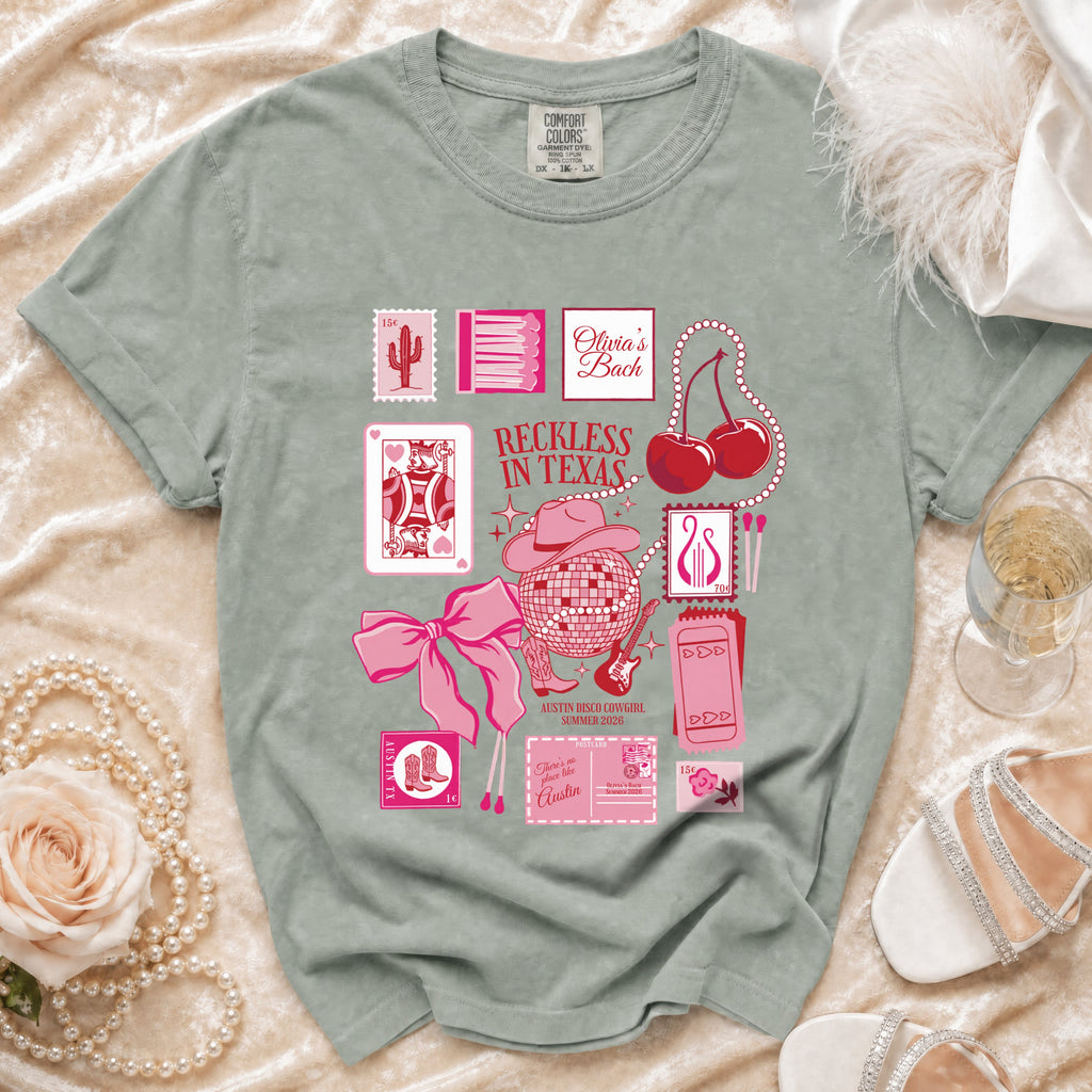 T-shirt design with "Reckless in Texas" text, disco ball, and cherries.
