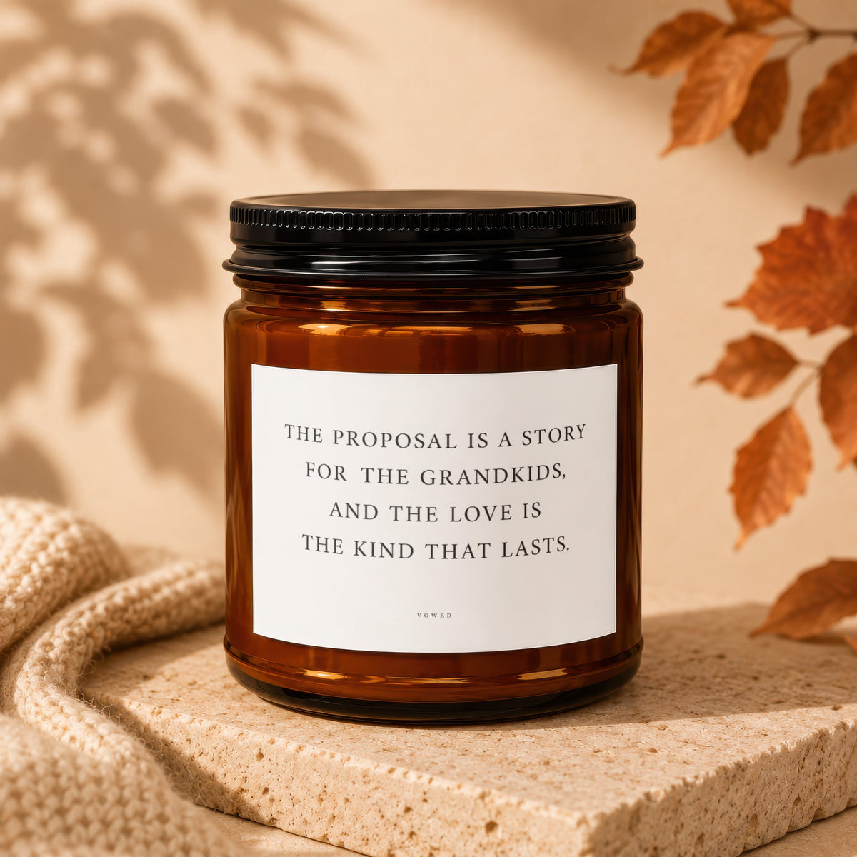 Amber jar candle with text "The proposal is a story for the grandkids, and the love is the kind that lasts."