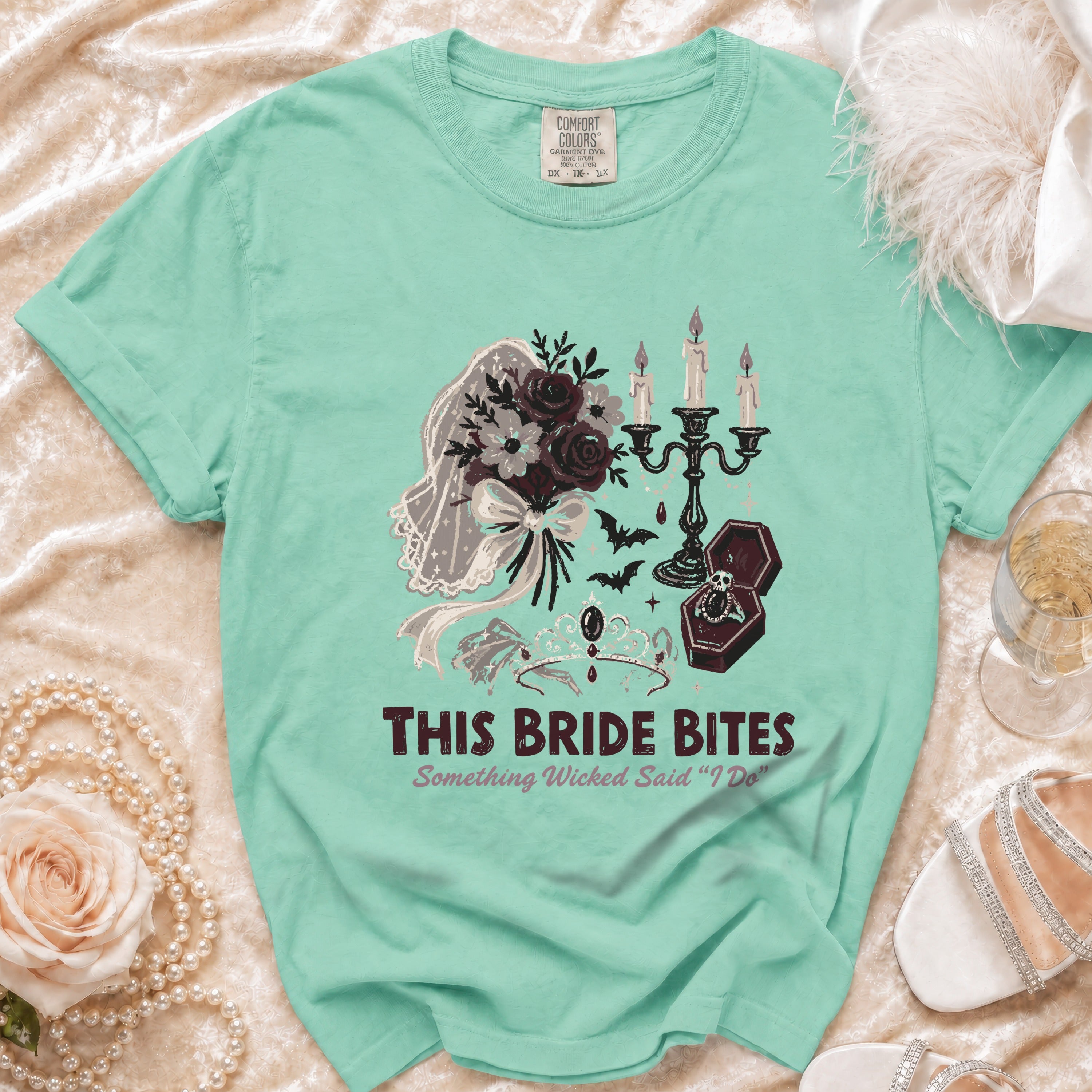 Teal t-shirt with "This Bride Bites" and gothic wedding graphics.