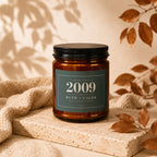Amber candle with label "Established 2009 Ruth + Caleb Still Going Strong".
