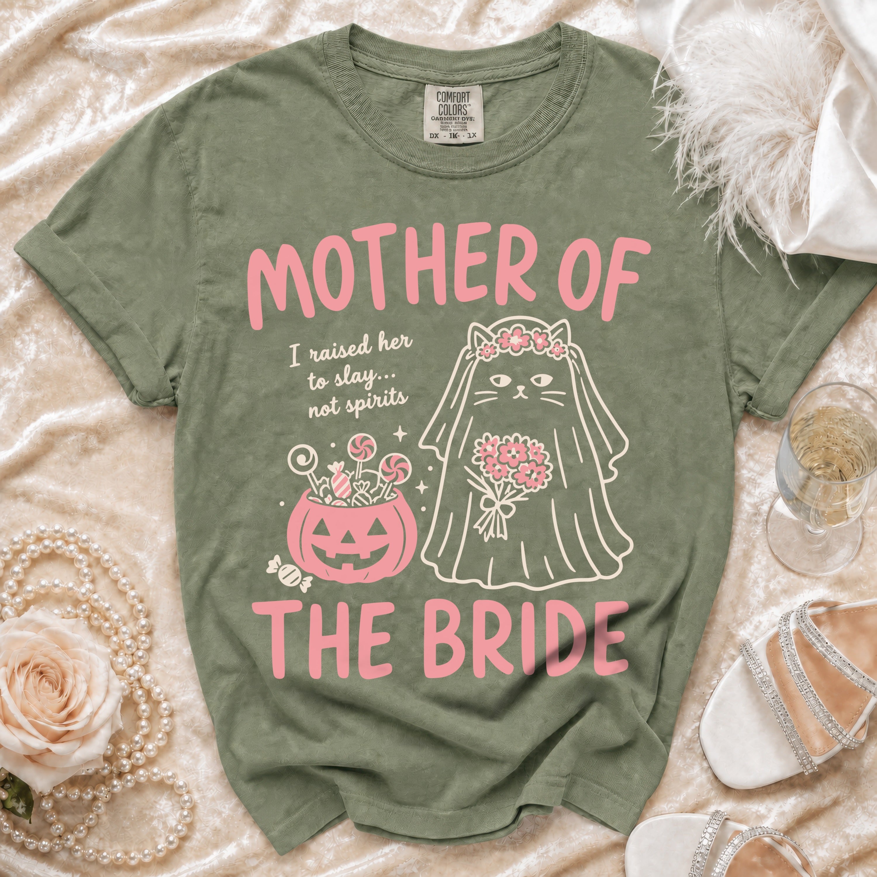 Green t-shirt with pink text "MOTHER OF THE BRIDE" and a cat bride graphic.