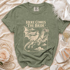 Olive t-shirt with "HERE COMES THE BRIDE" and bride riding a dragon graphic.
