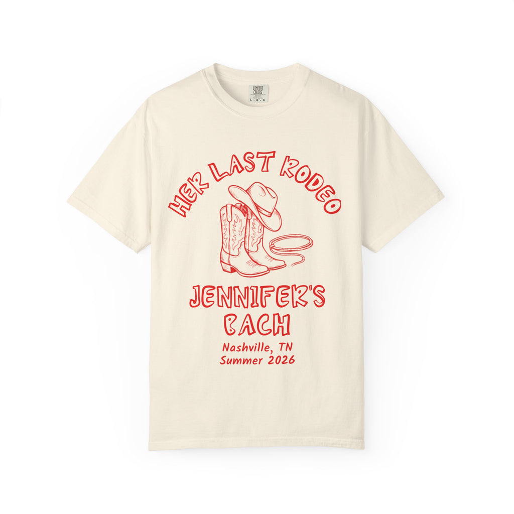 Cream t-shirt with "Her Last Rodeo" graphic featuring cowboy boots and lasso.