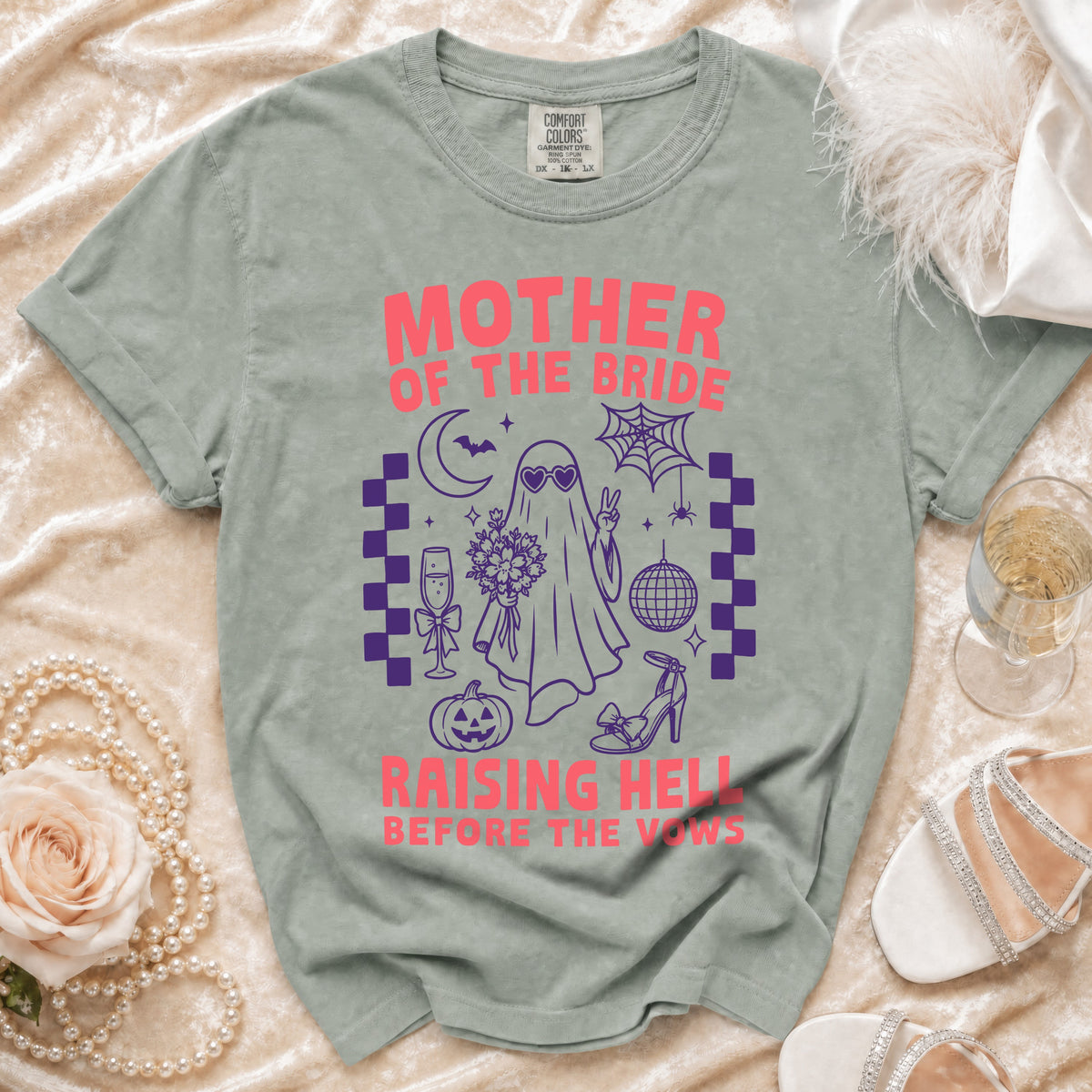 "Mother of the Bride Raising Hell Before the Vows" graphic tee with spooky elements.