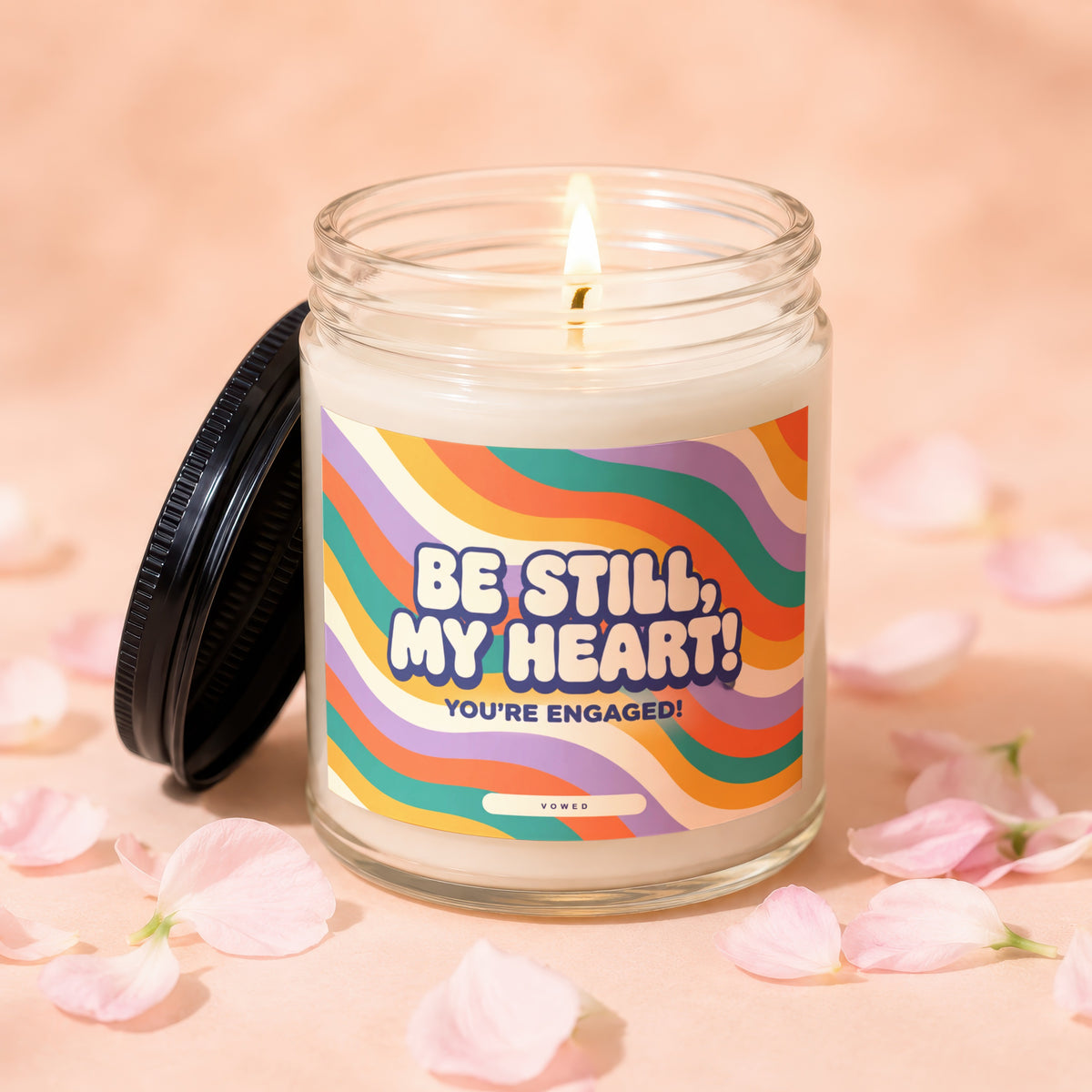 Candle with a lit wick and a "Be Still, My Heart! You're Engaged!" label.