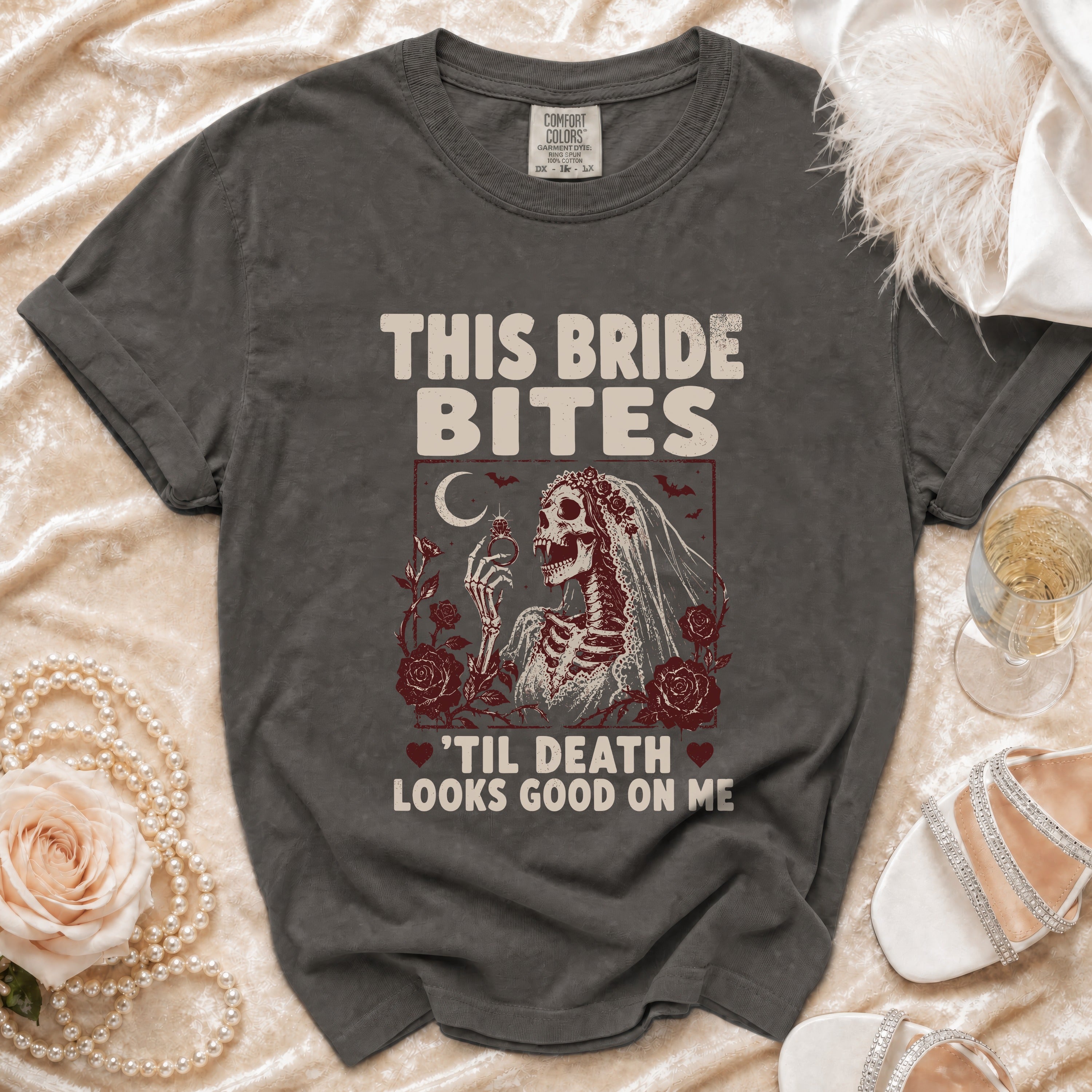 T-shirt with skeleton bride graphic and text "This Bride Bites 'Til Death Looks Good On Me."