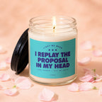 Lit candle with text "I replay the proposal in my head" on teal label.