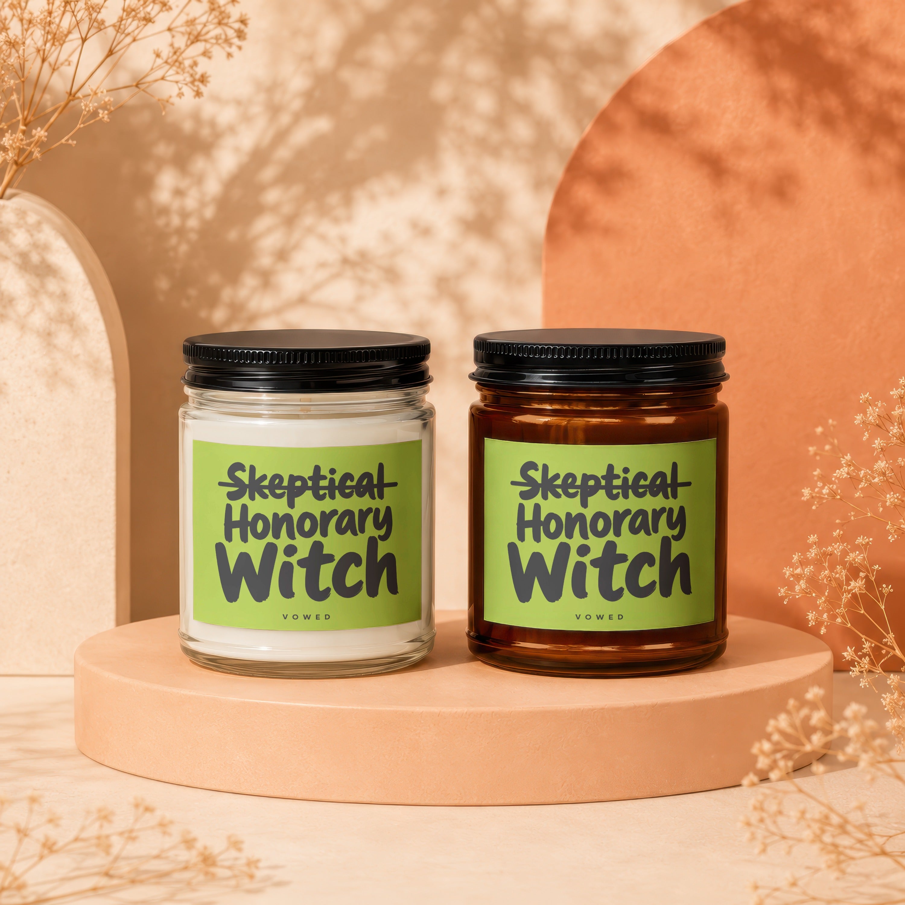 Two candles with green labels reading "Skeptical Honorary Witch" and "vowed" are displayed.