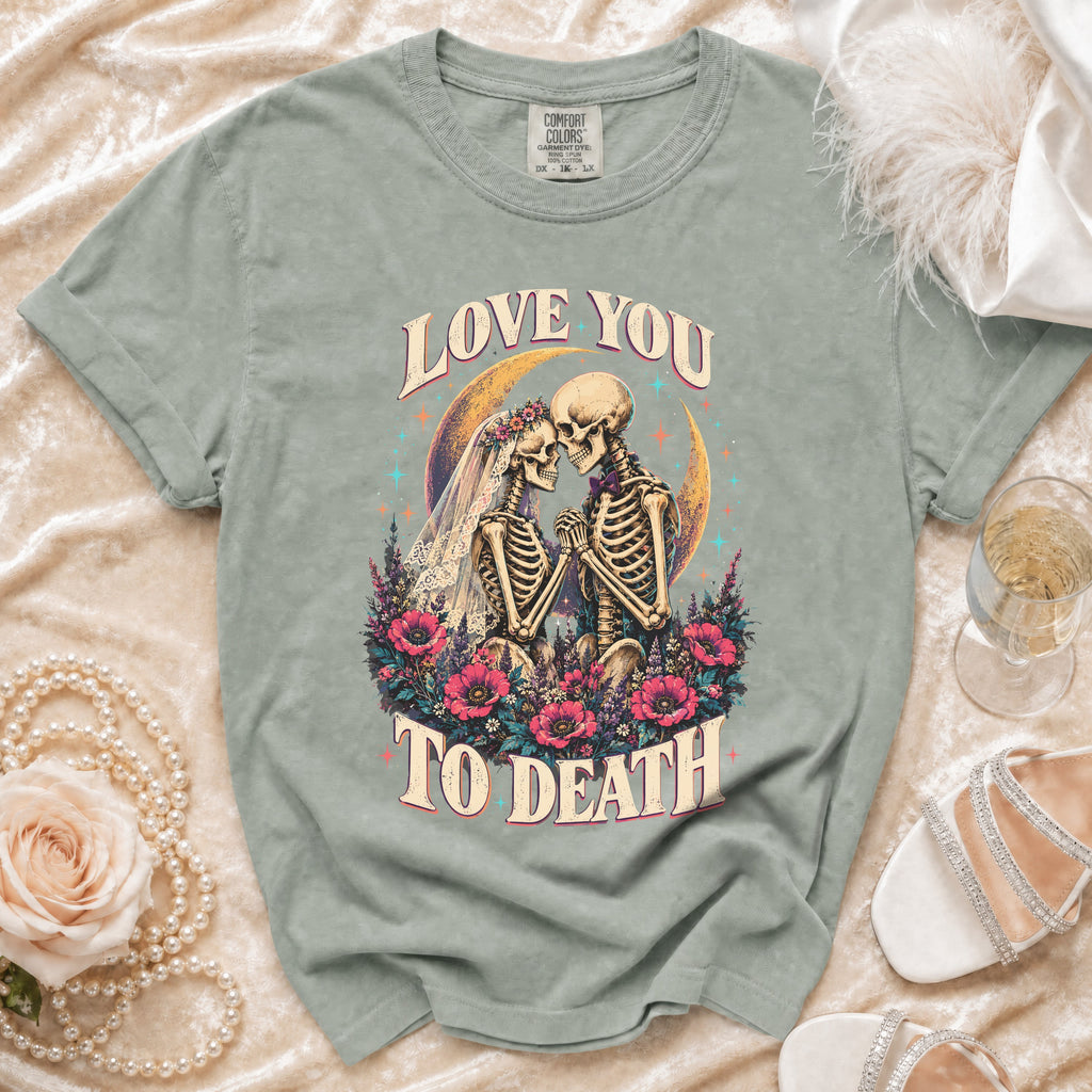 T-shirt with skeleton bride and groom graphic and text "Love You To Death".