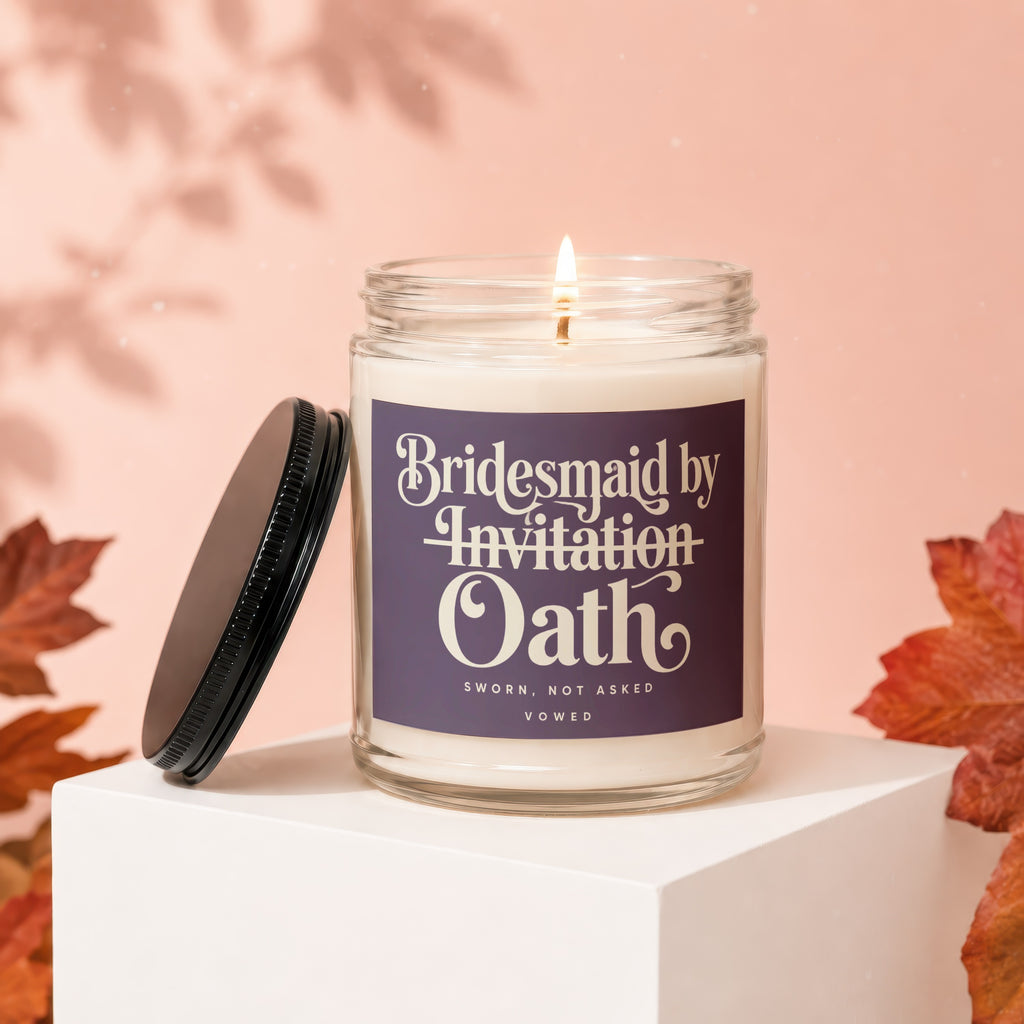 Candle labeled "Bridesmaid by Invitation Oath" with lid off, burning.