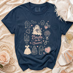 Dark blue t-shirt with gothic bride illustrations and text "Bride to be (Beware)".