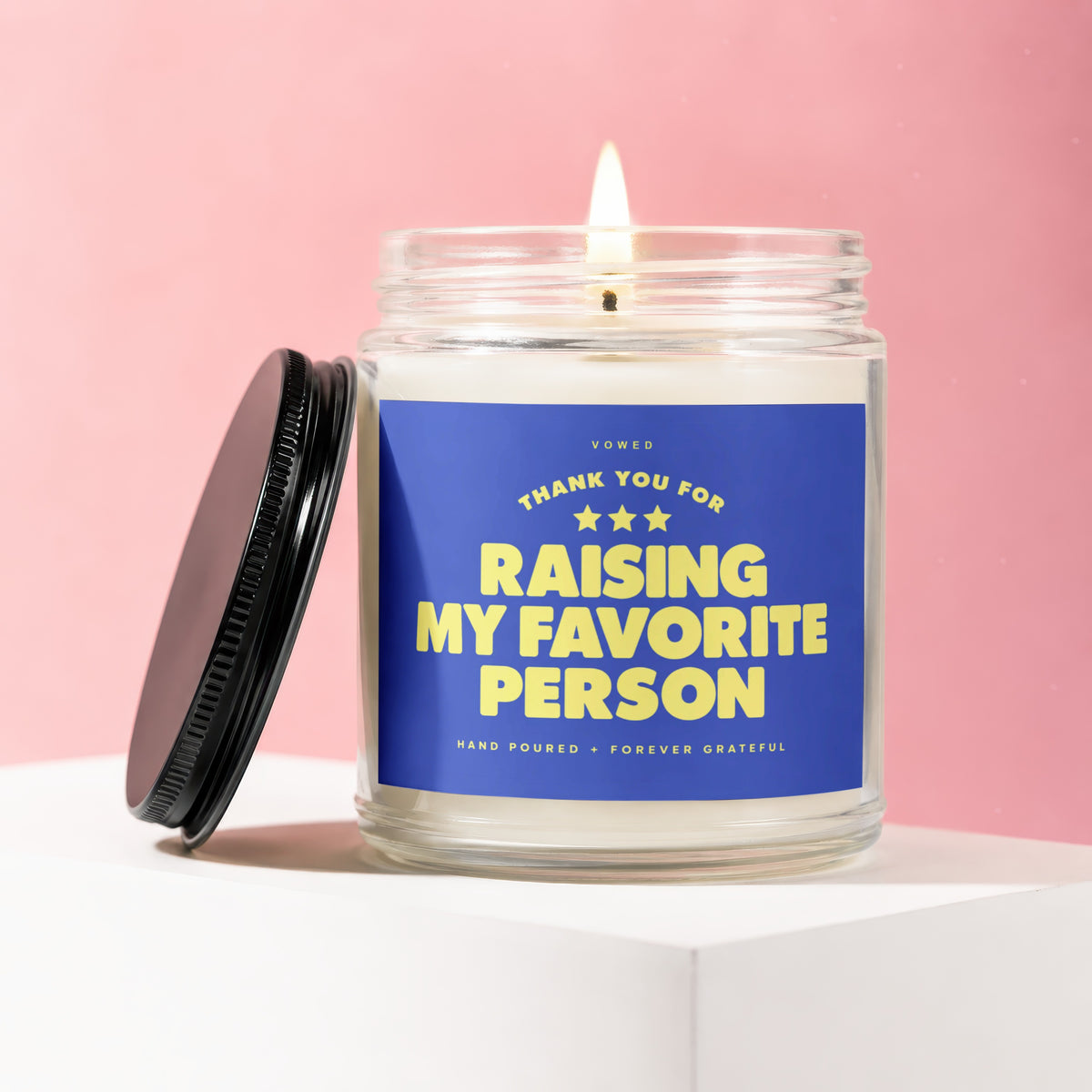 Glass candle with blue label reading "Thank You For Raising My Favorite Person".