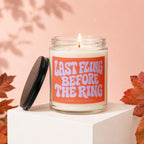 Candle with orange label saying "LAST FLING BEFORE THE RING" and "VOWED | HAND POURED".