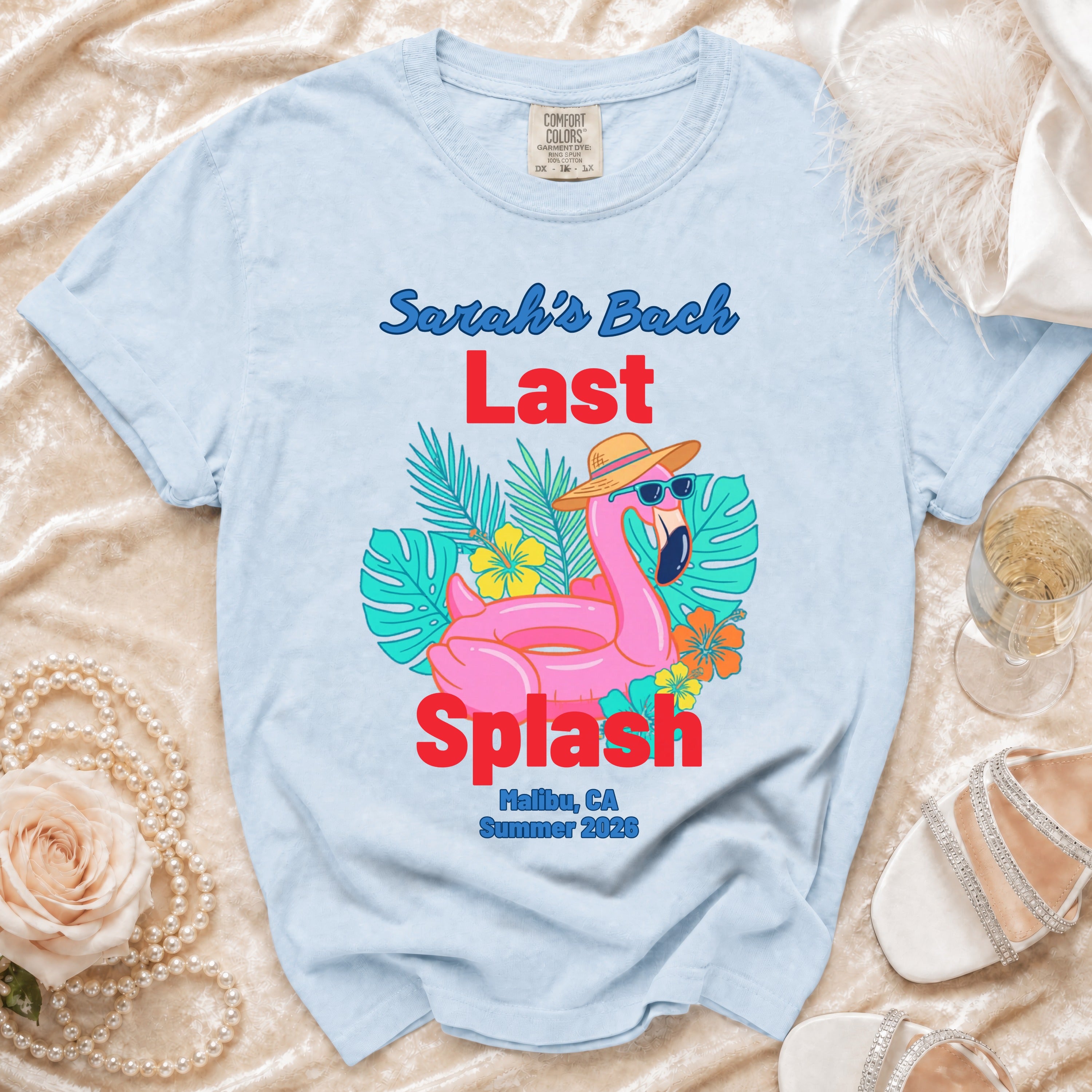 Light blue t-shirt with "Sarah's Bach Last Splash Malibu, CA Summer 2026" text and flamingo graphic.