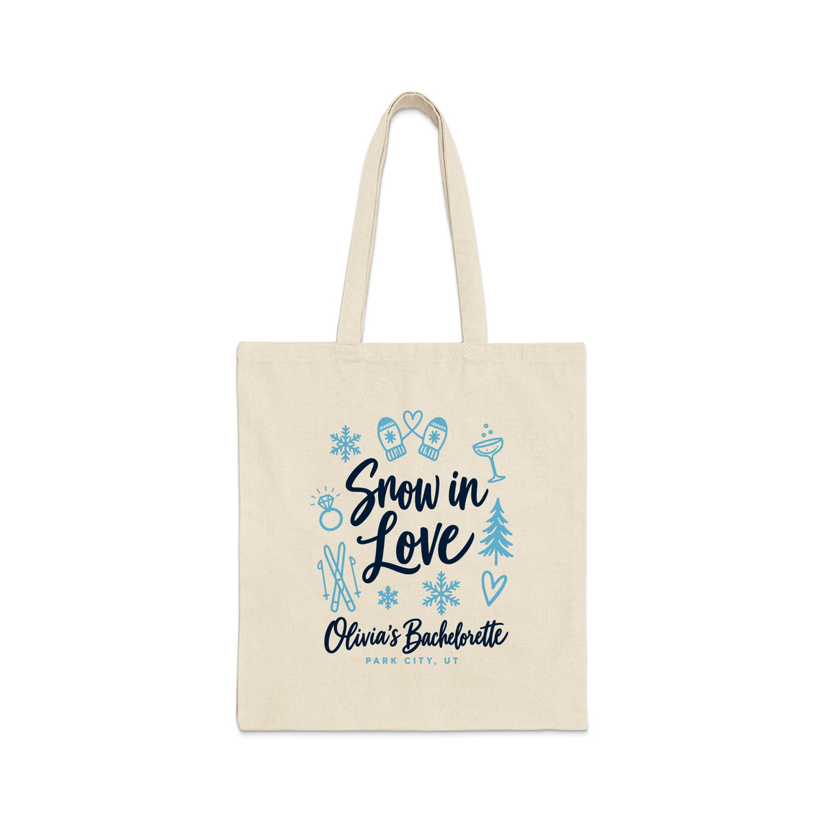 A beige canvas tote bag features blue graphics and text that reads Snow in Love, Olivia's Bachelorette, Park City, UT.